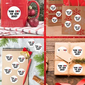 Round Thank You adhesive stickers for packaging shown on gift bags and boxes