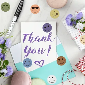 Colorful smiley face reward stickers on a Thank You card with floral decor