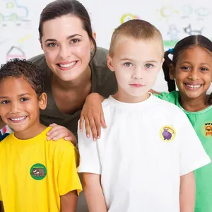 Children wearing cute cartoon animal reward stickers in a friendly classroom setting