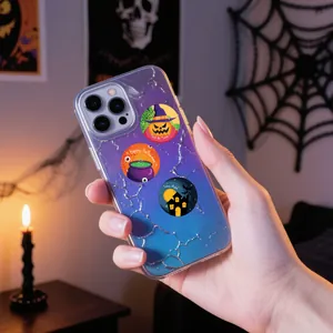 Close-up of Halloween stickers on phone case showing pumpkin and haunted house designs