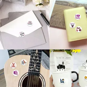 Cheerleading theme round stickers shown on envelopes, notebooks, and mugs for decoration.