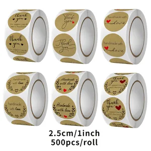 Six rouleaux d'autocollants Kraft avec les motifs 'Thank You' et 'Handmade with Love'.