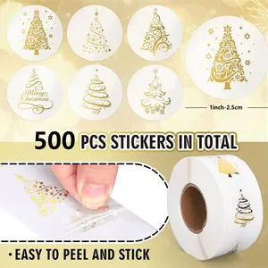 Detailed view of gold foil Christmas tree stickers roll showing peeling process and 1 inch size