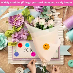 Detailed view of colorful smiley face reward stickers applied on a flower bouquet