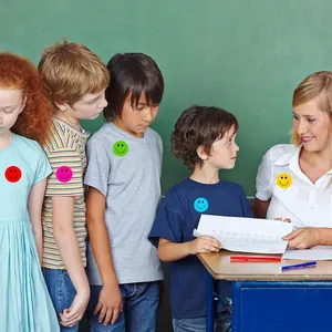 Teacher rewarding students with colorful smiley face stickers in a bright classroom