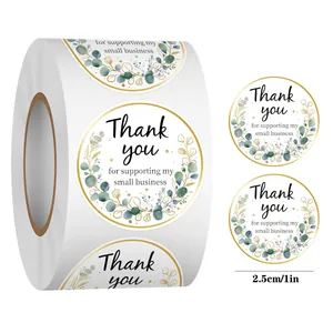 Close-up of 1-inch round Thank You stickers with eucalyptus leaves and gold foil border