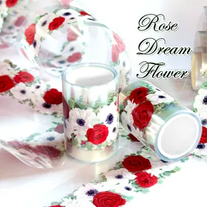 Detail view of Rose Dream Flower PET tape showing vibrant red and white floral patterns.