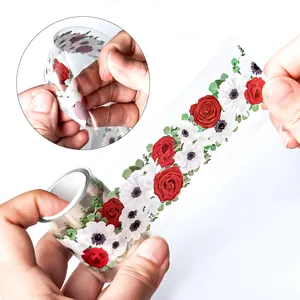 Detail view of floral PET tape showing red roses and white flowers being peeled