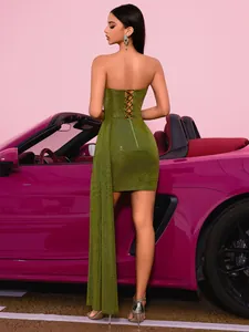 Back view detail of a sparkling green sequined strapless evening gown with a long train