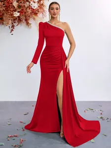 Full length view of elegant red one-shoulder evening gown with slit and bead trim
