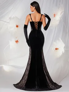Back view of black velvet mermaid evening gown with lace panels and corset detail