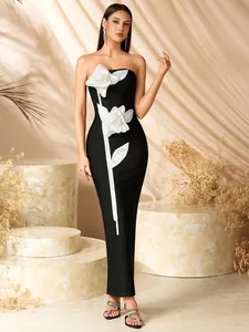 Elegant strapless black evening gown with 3D white flower design and slim fit silhouette