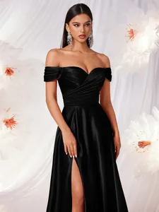 Elegant off-the-shoulder matte satin evening gown in black with a sexy high leg slit.