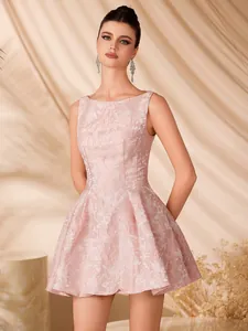 Detailed view of the pink jacquard fabric and sleeveless A-line silhouette of the dress.