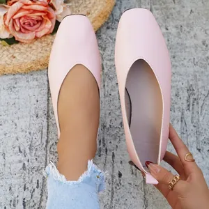 Detailed close-up showing light pink square toe ballet flats with premium textured finish