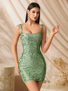 Detail of green sequined mini dress with vintage floral embroidery and bodycon fit