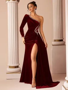 Elegant burgundy velvet one-shoulder evening gown with shimmering rhinestone detail.