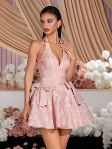 Elegant pink halter jacquard mini dress with deep V-neck and large waist bows detail.