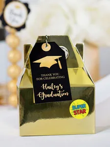 Close-up of a 'SUPER STAR' reward sticker applied to a metallic gold gift box for kids