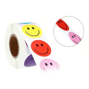 Close-up detail of colorful smiley face reward stickers on a roll for gift packaging.