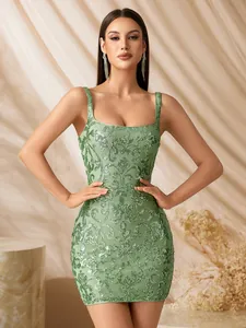Detailed shot of a green evening dress with intricate sequined floral patterns