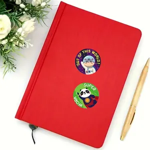 Detailed view of colorful reward stickers on a red notebook with cute animal designs.