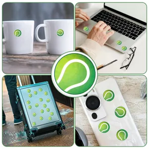 Detailed macro view of green tennis ball stickers applied on laptop, phone, and mug