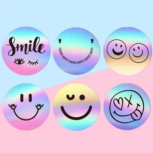 Collection of various holographic smiley face stickers with a vibrant laser effect
