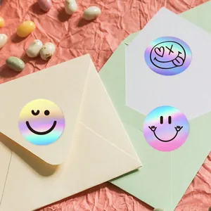 Detailed view of colorful holographic smiley face stickers used for envelope sealing decoration