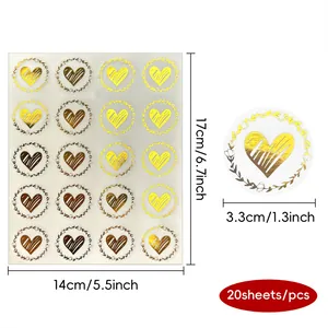 Dimensions of golden heart envelope seal stickers on a transparent sheet