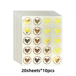 Detail showing gold foil heart stickers for envelopes, 200 pieces total on 10 sheets.