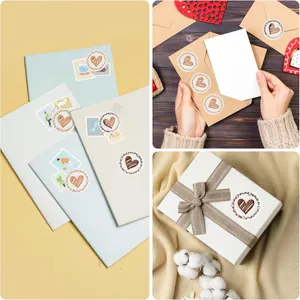 Application of decorative gold heart stickers on envelopes and gift boxes for sealing