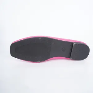 Bottom view of pink loafer shoe showing non-slip black rubber sole with size mark