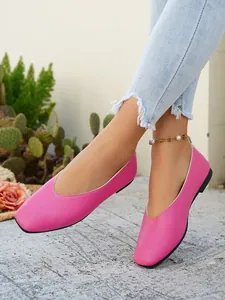 Detail of pink pebble leather flat shoes with square toe on model