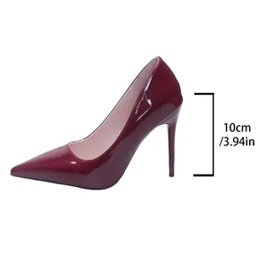 Detailed view of 10cm stiletto heel height on burgundy patent leather pump