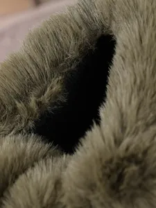 Macro close-up shot showing the thick plush faux fur lining inside warm winter snow boots