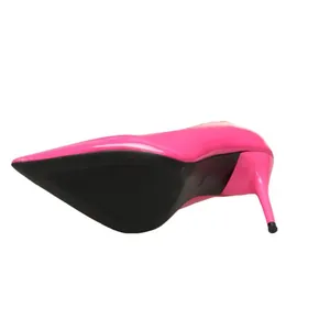 Detailed bottom view of elegant pink patent leather stiletto pumps with pointed toe design.