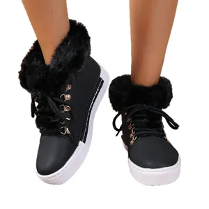 Stylish black women's snow boots featuring thick faux fur trim and white platform soles