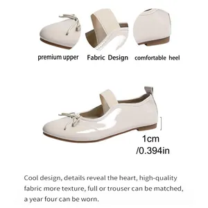 Detail view of beige Mary Jane flats with 1cm heel height and bow accent for girls