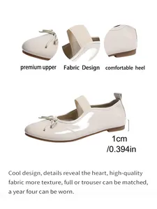 Detail of beige patent leather Mary Jane flats with elastic strap and 1cm heel.
