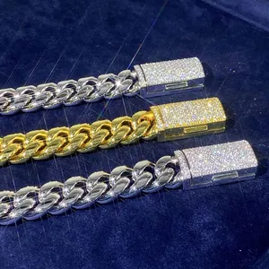 Close-up of 18mm stainless steel Cuban link chains with pavé set moissanite clasps.