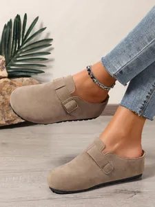 Casual beige suede mule clogs for women featuring an adjustable metal buckle strap