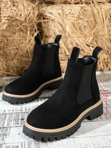 Black suede Chelsea boots with 4.5cm thick lugged sole and elastic side panels
