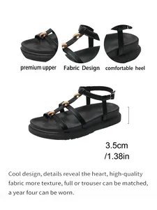 Sandali gladiatore neri da donna con borchie dorate, fibbia e suola platform da 3,5 cm