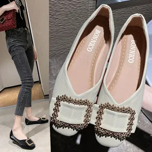 Elegant pointed toe flat shoes for women featuring a decorative metallic square buckle detail.