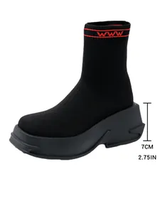 Detail view showing 7cm chunky platform heel height on these black knit sock boots