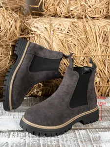 Detail view of grey Chelsea boots featuring a 4.5cm lug sole and suede texture.