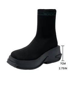 Side profile of black knitted sock boot with 7cm platform heel height detail.