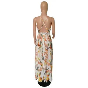 Back view of floral print chiffon maxi dress featuring an elegant crisscross strap detail