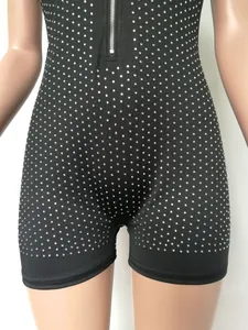 Close-up of black sleeveless bodysuit with rhinestone pattern and front zipper